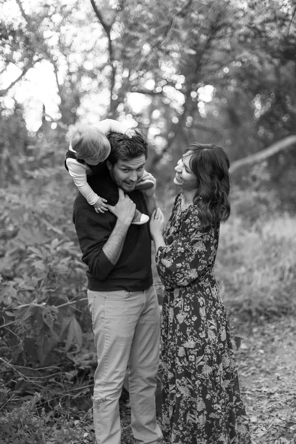 Alicia outdoors with her husband and their young child